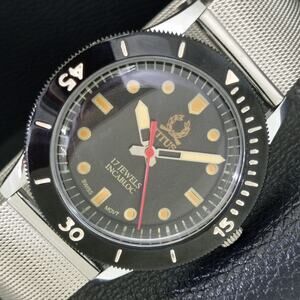 Vintage 1975 Titus Manual Mens Silver Watch W/Mesh Strap & Orange accents